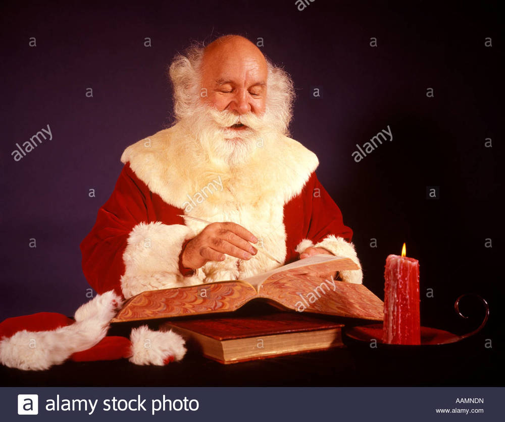 1950s-1960s-1970s-bald-santa-claus-writing-list-in-big-book-by-candle-AAMNDN.jpg